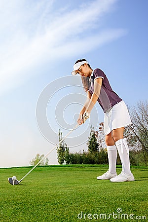 Woman ready to hit the golf ball