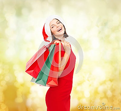 Woman in red dress with shopping bags