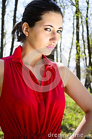 Woman in red dress in woods