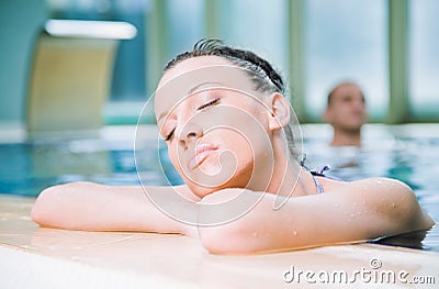 Woman relaxing swimming pool