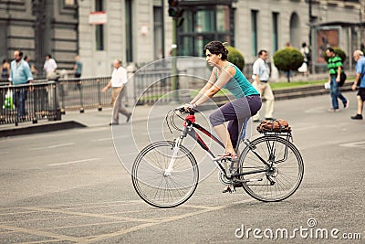 Woman Riding a Bike in Alcala Street, Madrid