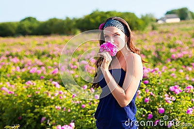 Woman in rose garden