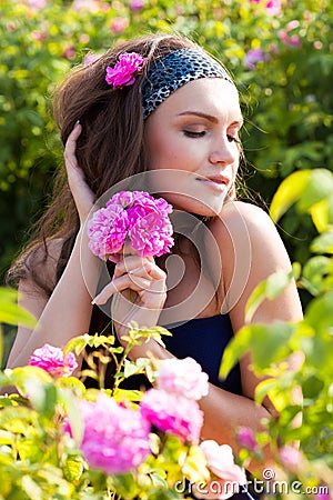 Woman in rose garden