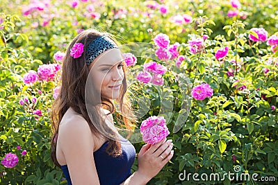 Woman in rose garden