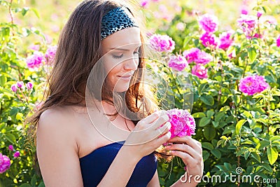 Woman in rose garden