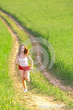 Woman running in the fields