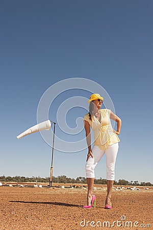 Woman at rural airport in high heels