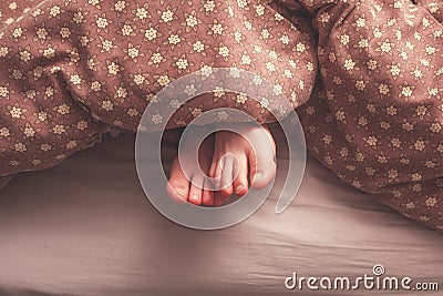 Woman s feet in bed