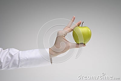 Woman s hand holding an apple