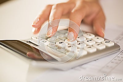 Woman s hands with a calculator, Accounting.