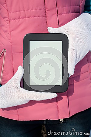 Woman s hands holding e-book reader