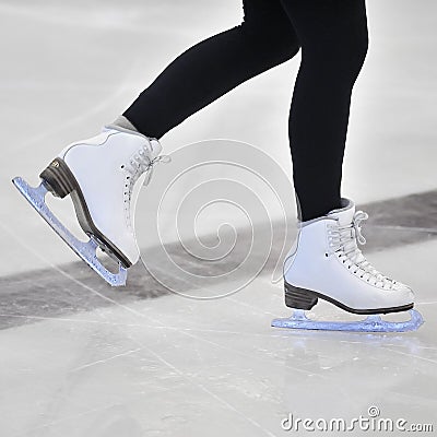 Woman s Legs in White Ice Skates