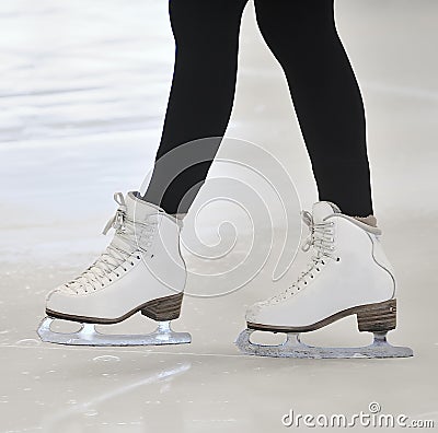 Woman s Legs in White Ice Skates