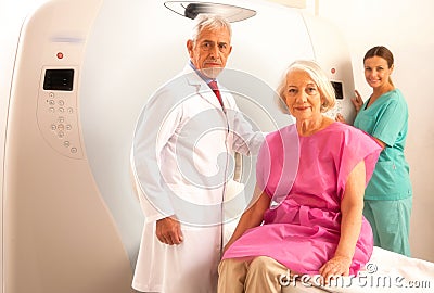 Woman in 60s ready to be checked under mri scanner with senior d