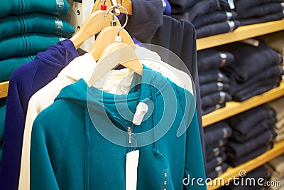 Woman s sweats hanging in trendy boutique