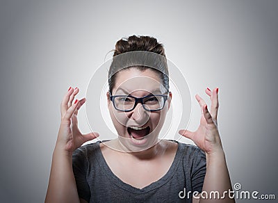 Woman screaming in horror, grimace portrait