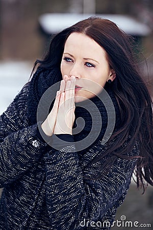 Woman Shivering in the Frozen Outdoors