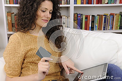 Woman shopping online with credit or gift card