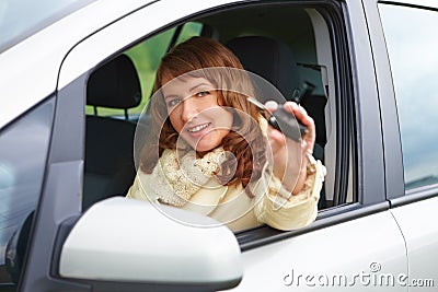 Woman showing car keys