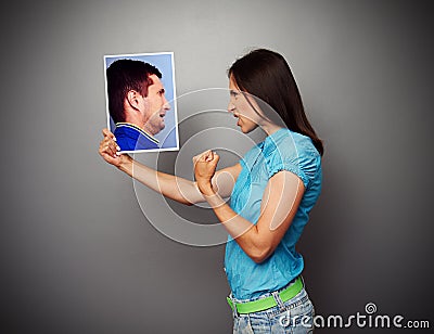 Woman showing fist to scared man