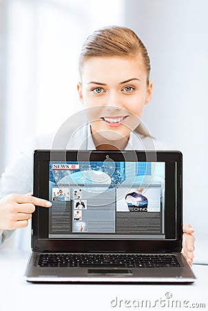 Woman showing laptop pc with news