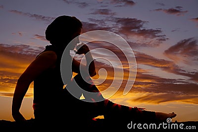 Woman sit silhouette arm kknee hand by face