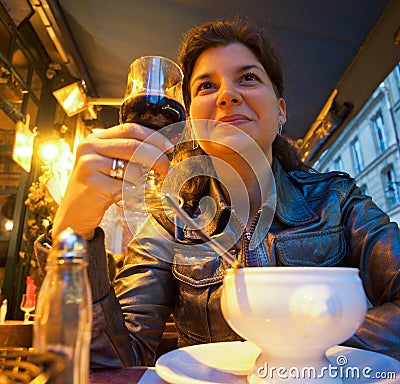 sitting restaurant woman holding smiling wine glass beautiful red