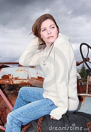 Woman sitting on a tractor