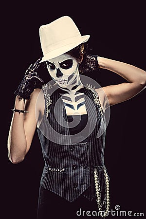 Woman with skeleton face art smoking