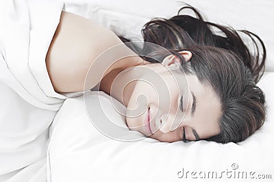 Woman sleeping and having nice dream