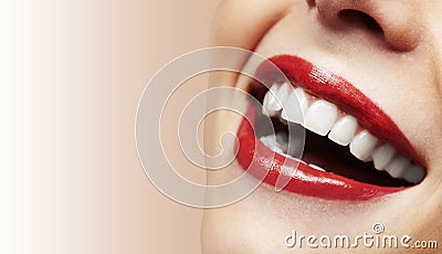 Woman smiling with great teeth on white background