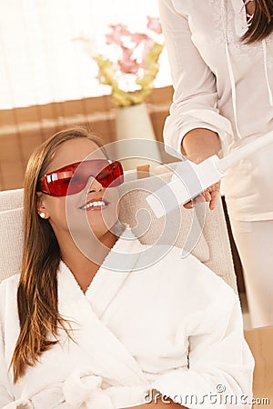 Woman smiling after laser tooth whitening