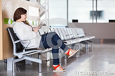 Woman spending time in airport lounge
