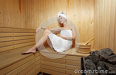 Woman and steam-bath at sauna