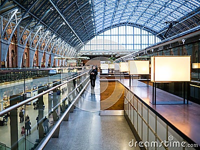 Woman strolling walkway on second level of St Panc