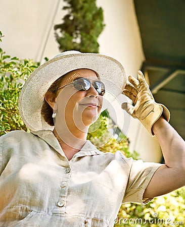 Woman in Sun Hat and Gardening Gloves