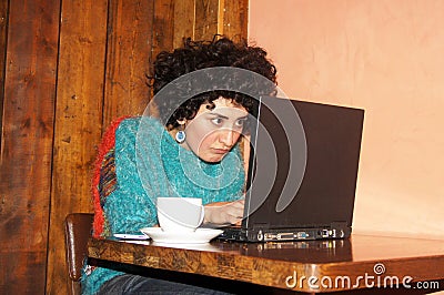 Woman surfing at a café