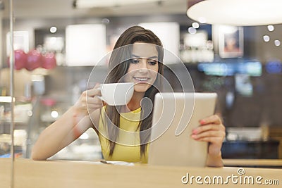 Woman with tablet at cafe