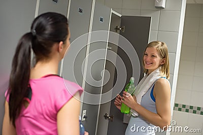 Woman talking with friend in changing room