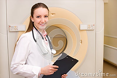 Woman Technologist with CT Scan Machine