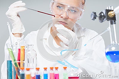 Woman with test tubes in a chemistry