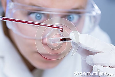 Woman with test tubes in a chemistry