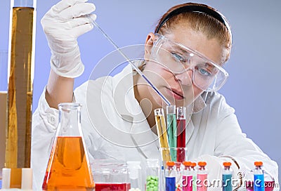 Woman with test tubes in a chemistry