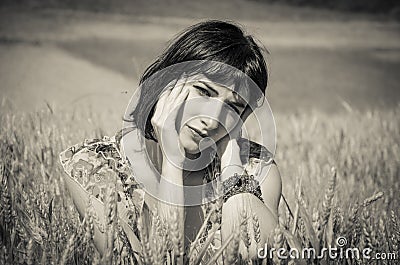 Woman thinking on field