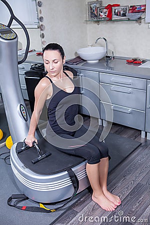 Woman on trainer machine in sport gym