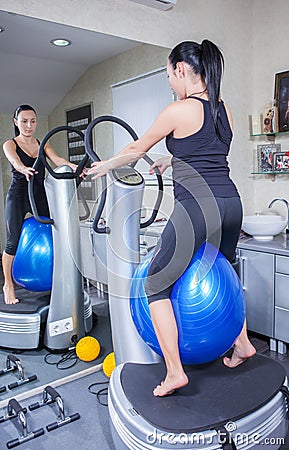 Woman on trainer machine in sport gym