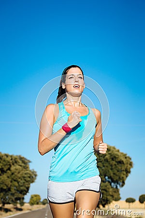 Woman training for running summer marathon