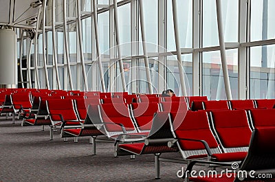 Woman traveler sleeps at Hong Kong Airport