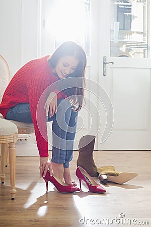 Woman trying on footwear in store