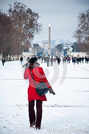 Woman in tuileries garden in Paris by winter